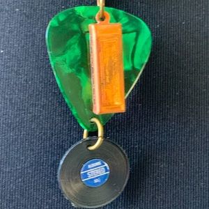 Necklace harmonica guitar pick record album green